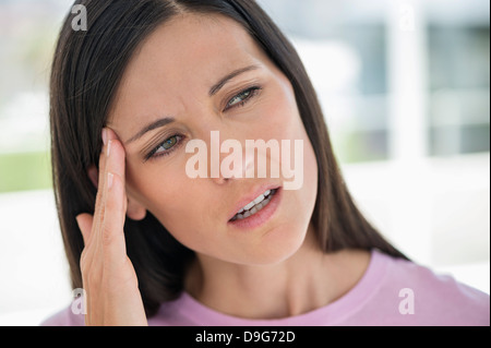 Woman suffering from a headache Stock Photo
