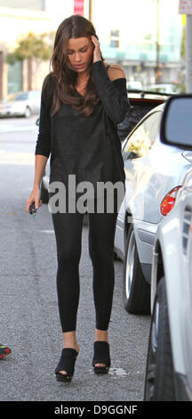 Sofia Vergara hiding her face with her hair when being dropped back to