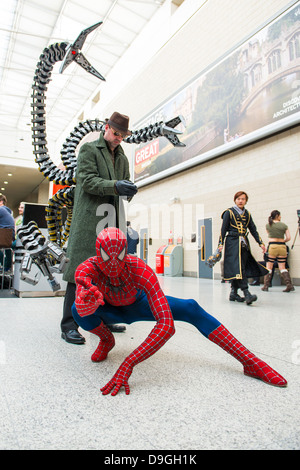 A father and his son cosplay DC character Batman (Left) and Marvel's  Spiderman enemy Doctor Octopus (Right) during the first day of the SOFA  (Salon del Ocio y la Fantasia) 2021, a