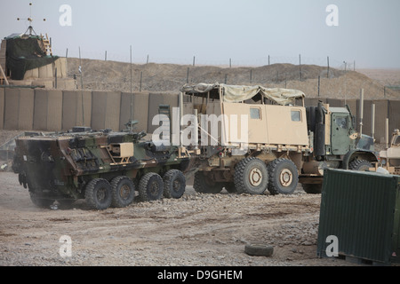 Marines with Combat Logistics Battalion 5, tow a light armored vehicle at Forward Operating Base Payne, Afghanistan, Stock Photo