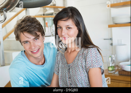 Portrait of a couple smiling in the kitchen Stock Photo