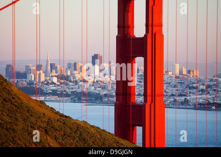 A view at dusk thru the Golden Gate Bridge towards downtown San Francisco. In California, USA. Stock Photo