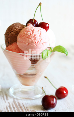 Cherry ice cream on white planks in restaurant Stock Photo