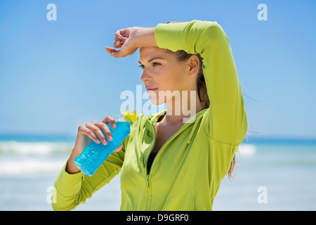 Woman drinking water from a bottle Stock Photo