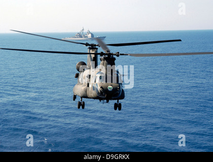 A U.S. Army MH-47 Chinook prepares to land. Stock Photo