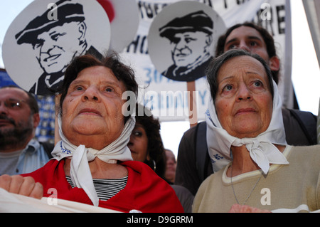 Women belonging to the association Mothers of the Plaza de Mayo accompany a protest in the capital of Argentina. Stock Photo