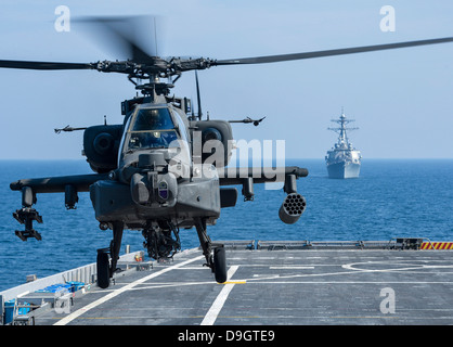 An Army AH-64D Apache helicopter takes off from USS Ponce. Stock Photo