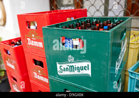 crates of empty beer bottles for recycling outside a small local bar in baga catalonia spain Stock Photo