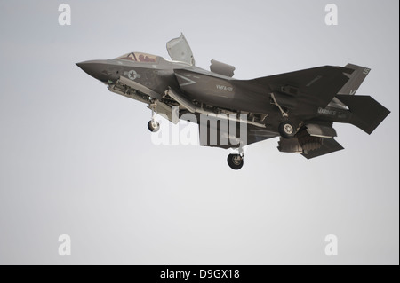 An F-35B Lightning II Joint Strike Fighter prepares to make a vertical landing. Stock Photo