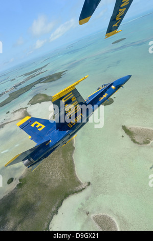 An F/A-18 Hornet of the Blue Angels flies over the Florida Keys. Stock Photo