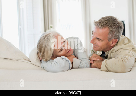 Senior couple resting on the bed Stock Photo