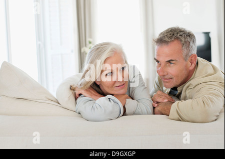 Senior couple resting on the bed Stock Photo