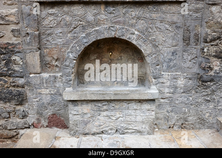 water fountain in placa porxada galceran de pinos arcaded main town square in medieval baga catalonia spain Stock Photo