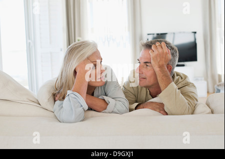 Senior couple resting on the bed Stock Photo