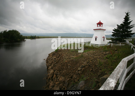 A Lighthouse located on the other side of The Shepody River Tidal Dam in New Brunswick. Stock Photo