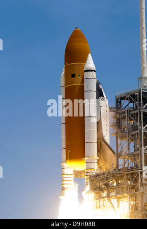 Space shuttle Atlantis' twin solid rocket boosters ignite to propel the spacecraft off Kennedy Space Center's Launch Pad 39A. Stock Photo
