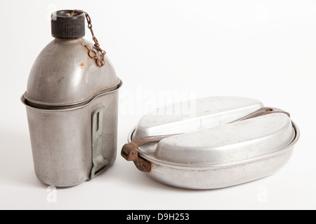 World War Two US Army water bottle and mess tins against a white background. Stock Photo