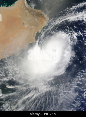 A tropical storm in the Arabian Sea is framed with ISS spaceship. Image ...