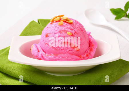 Scoop of pink ice cream in a dessert bowl Stock Photo