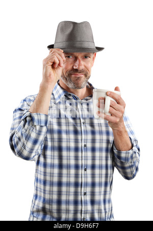 A brightly lit portrait of a 40-something male with a soft smile wearing a fedora and holding a cup of coffee, isolated on white Stock Photo