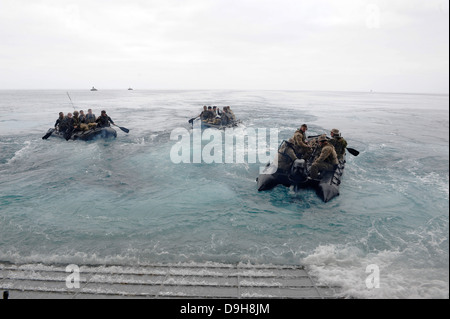 US Marines from the 13th Marine Expeditionary Unit launch Combat Rubber Raiding Craft from the amphibious assault ship USS Boxer June 15, 2013 off San Diego, CA. Stock Photo