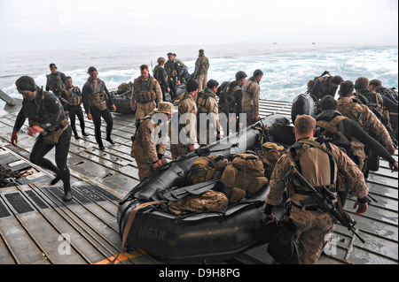 US Marines from the 13th Marine Expeditionary Unit launch Combat Rubber Raiding Craft from the amphibious assault ship USS Boxer June 15, 2013 off San Diego, CA. Stock Photo