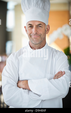 Portrait of a chef smiling with arms crossed Stock Photo
