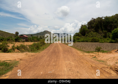 Typical dusty Country Road in the Kampot Province, Cambodia Stock Photo