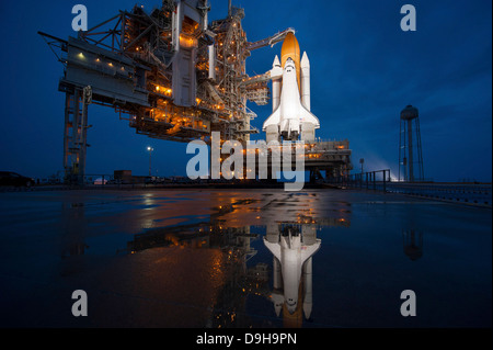 Night view of space shuttle Atlantis on the launch pad at Kennedy Space ...