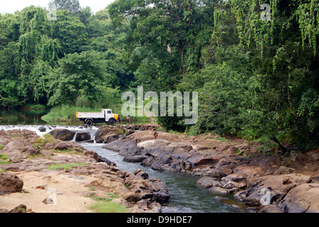 Lorry Washing in the Middle of River Stream on rural Village Outskirts at Kerala India Stock Photo