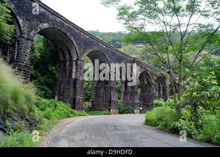 13 pillar Old Railway Bridge on Kollam Shenkottai Railways Line across the western ghats built by British East India Company Stock Photo