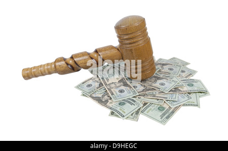 A super sized ceremonial wooden gavel with ornate twists on a pile of money - path included Stock Photo