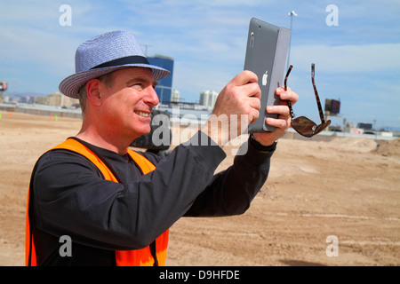 Las Vegas Nevada,Dig This,hands on,hands-on,bulldozer,excavator,under new construction site building builder,equipment,adult adults man men male,takin Stock Photo