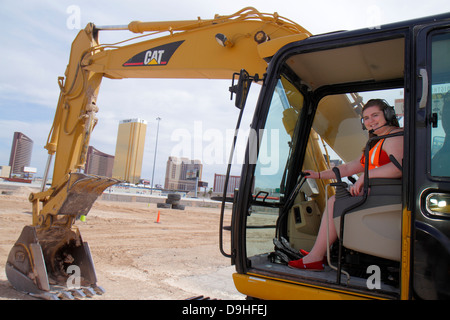 Las Vegas Nevada,Dig This,hands on,hands-on,bulldozer,excavator,under new construction site building builder,equipment,orientation,Caterpillar 315C hy Stock Photo