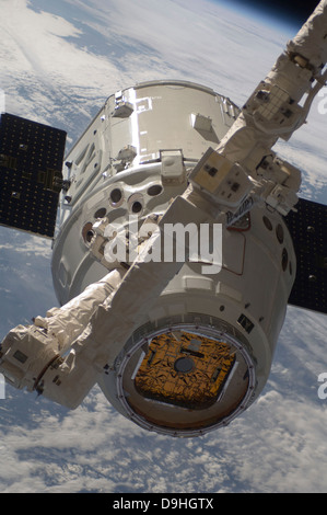 The SpaceX Dragon commercial cargo craft during grappling operations with Canadarm2. Stock Photo