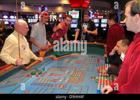 Las Vegas Nevada,Downtown,Plaza Hotel & Casino,gamble,gambling,gamblers,craps,dice,tossing,throwing,adult adults man men male,stickman,base dealer,box Stock Photo