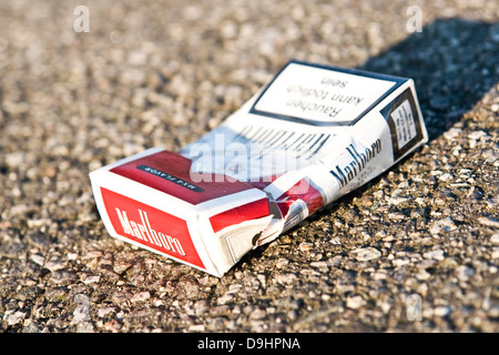 Empty box of Marlboro cigarettes thrown away on the street,wrinkled ...