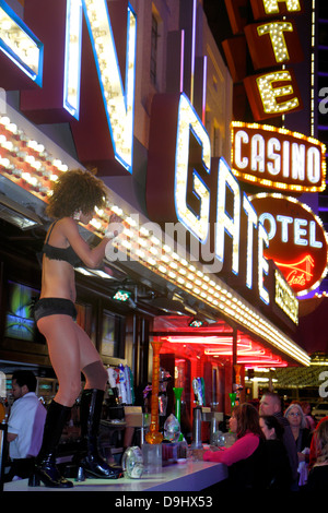 Las Vegas Nevada,Downtown,Fremont Street Experience,pedestrian mall arcade,night nightlife evening after dark,neon signs,adult adults woman women fema Stock Photo