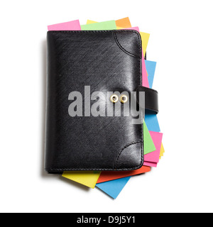 Black notebook with colorful note papers on white background, clipping path included Stock Photo