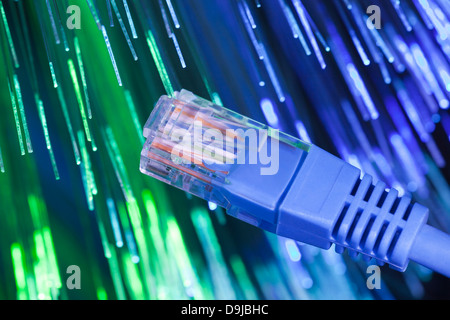 Network cable with fiber optical background Stock Photo