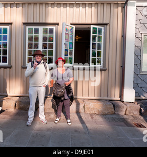 Couple taking a cigarette break, while attending a summer festival known as Menningarnott (Cultural Night) Reykjavik, Iceland Stock Photo