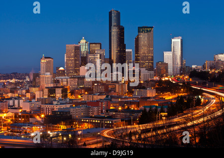 Seattle cityscape at night with the Columbia Tower and freeway, as seen from Dr. Jose Rizal Park, Seattle, Washington. Stock Photo