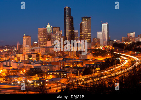 Seattle cityscape at night with the Columbia Tower and freeway, as seen from Dr. Jose Rizal Park, Seattle, Washington. Stock Photo