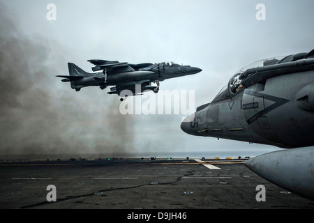 A US Marine Corp A/V-8B Harrier fighter jet performs a vertical take off on the flight deck of the amphibious assault ship USS Boxer during exercise Dawn Blitz June 15, 2013 near San Diego, CA. Stock Photo