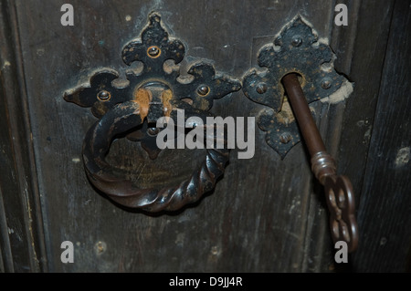 A church door handle and key Stock Photo
