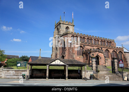 The village of Audlem, Cheshire with the Church of St James the Great and the Buttercross in front of it Stock Photo
