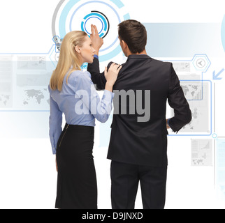man and woman working with virtual screen Stock Photo