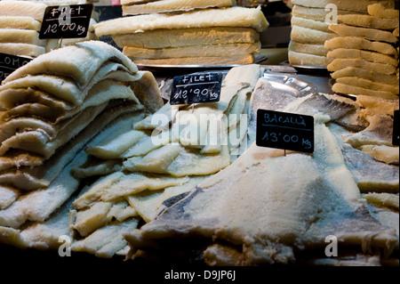 Stack of dried Salt Cod fish on a market stall fishmongers in Barcelona Spain Stock Photo