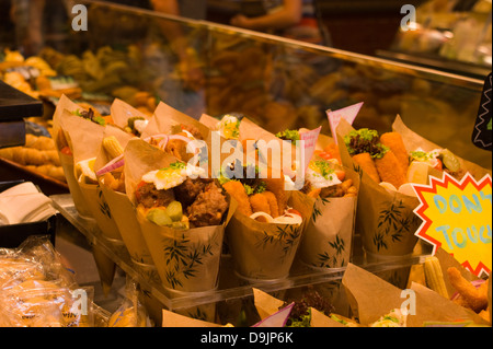Ready made snack lunch packs in Cones on a stall in the La Bouquaria market in Barcelona Spain Stock Photo