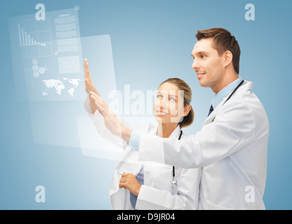 two doctors working with virtual screen Stock Photo